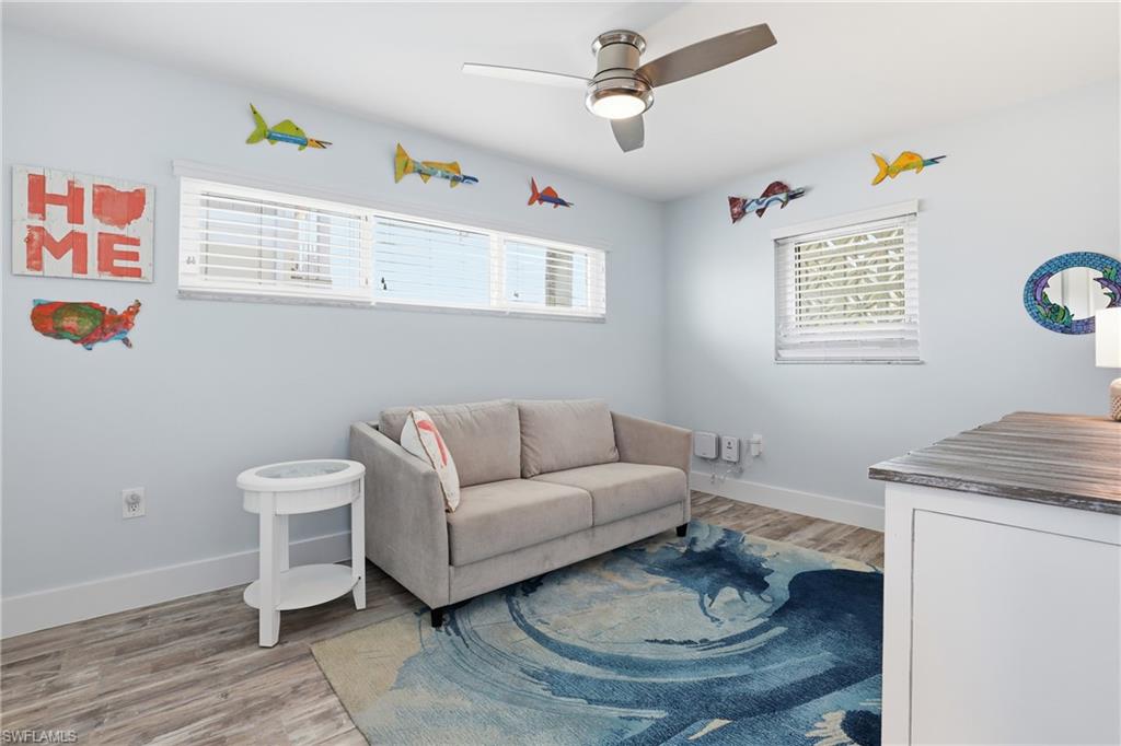 17 Palmview Boulevard Fort Myers Beach, FL 33931 - Photo 20 of 36 a living room with furniture and a window