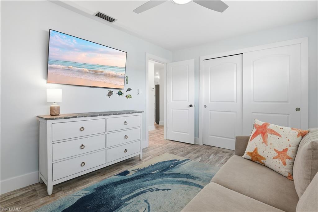 17 Palmview Boulevard Fort Myers Beach, FL 33931 - Photo 21 of 36 a living room with furniture and a window