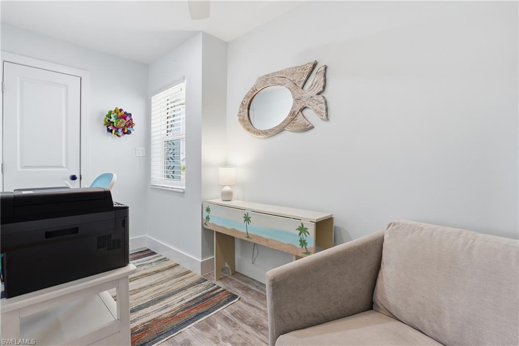 17 Palmview Boulevard Fort Myers Beach, FL 33931 - Photo 22 of 36 a living room with furniture and a mirror