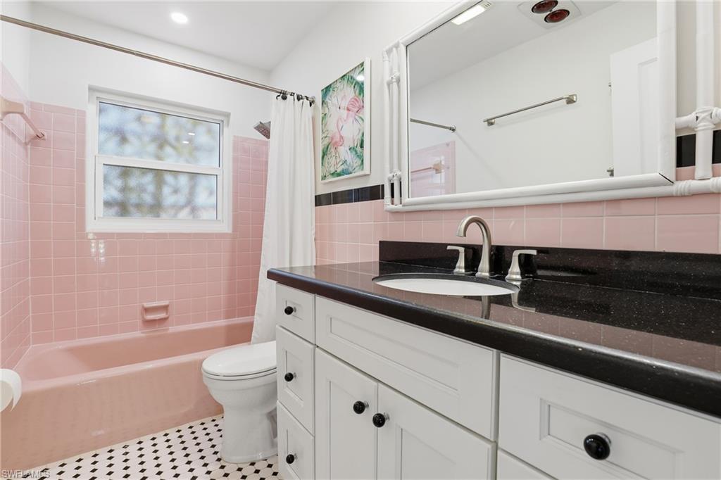 17 Palmview Boulevard Fort Myers Beach, FL 33931 - Photo 23 of 36 a bathroom with a sink a toilet and a bathtub