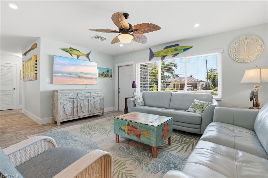 17 Palmview Boulevard Fort Myers Beach, FL 33931 - Photo 7 of 36 a living room with furniture and a large window