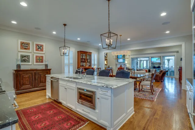 a kitchen with granite countertop a stove and a wooden cabinets