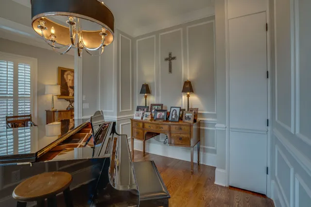 a large kitchen with stainless steel appliances granite countertop a sink a stove and a refrigerator