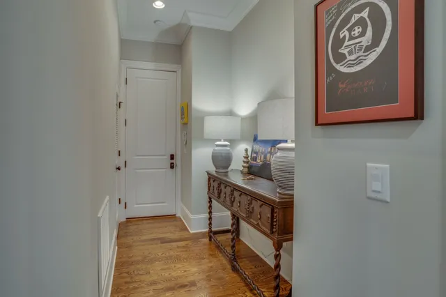 a large kitchen with stainless steel appliances granite countertop a stove and a wooden floors