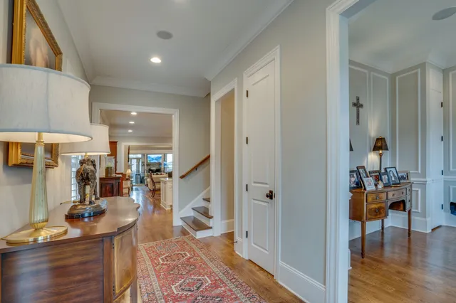 a kitchen with stainless steel appliances granite countertop a stove a refrigerator a sink dishwasher a dining table and chairs