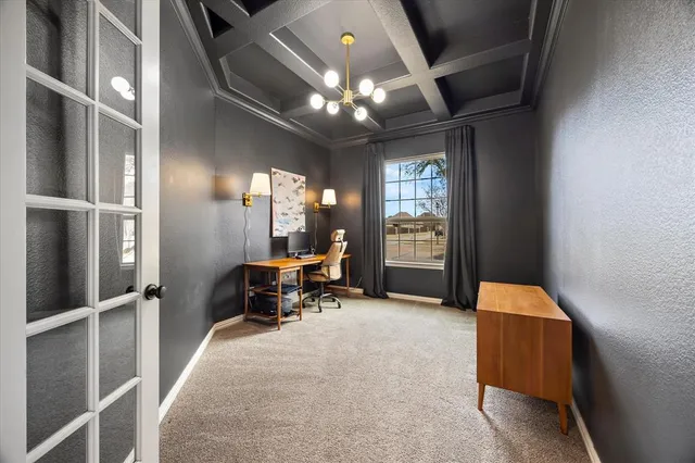 a lobby with furniture and chandelier