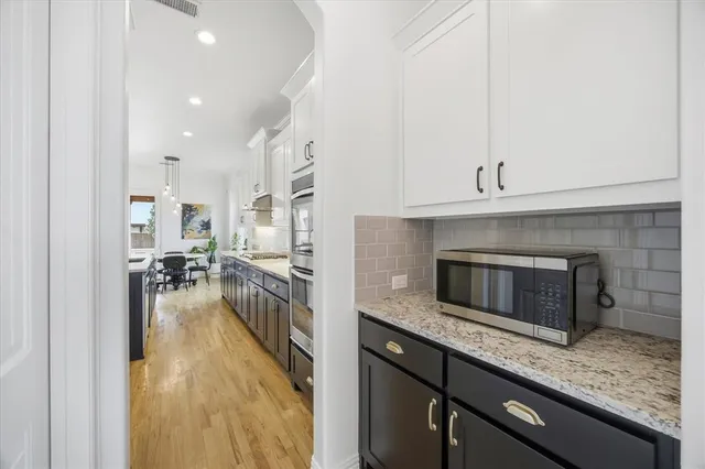 a kitchen with a stove and a refrigerator