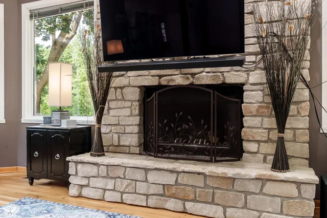 a living room with furniture and a fireplace