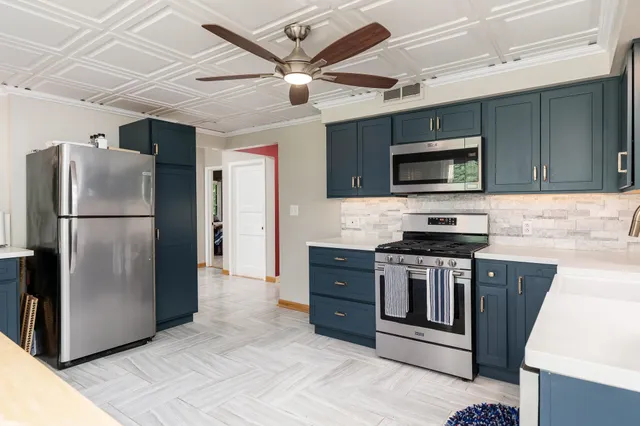 a bathroom with a sink mirror and toilet