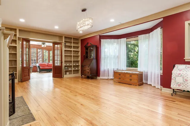 a view of a dining room with furniture wooden floor and windows