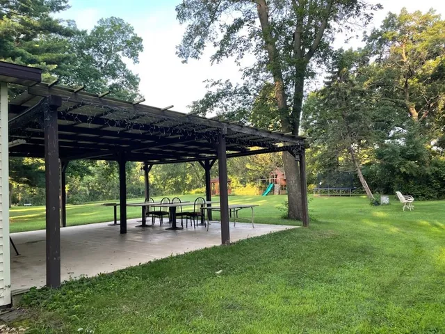 a dining room with furniture and window
