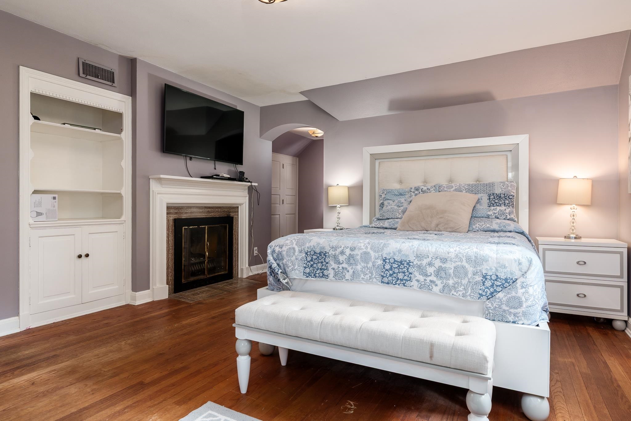 2373 Geddes Road Rockford, IL 61103 - Photo 37 of 97 a bedroom with a bed and a fireplace