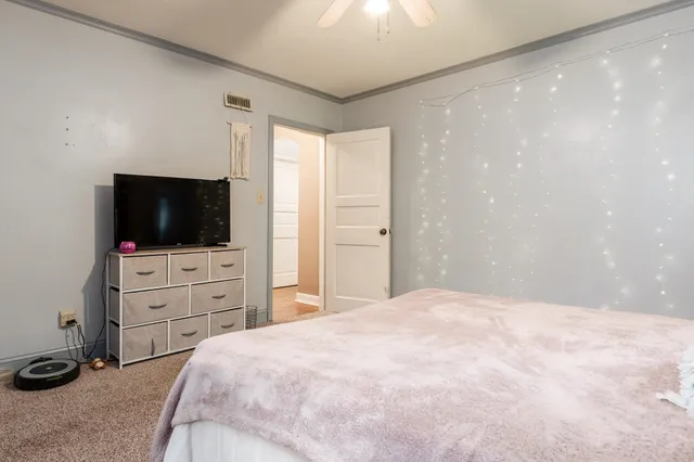 a front view of a house with a yard and porch