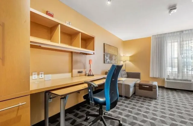 a view of a kitchen with a sink and cabinets