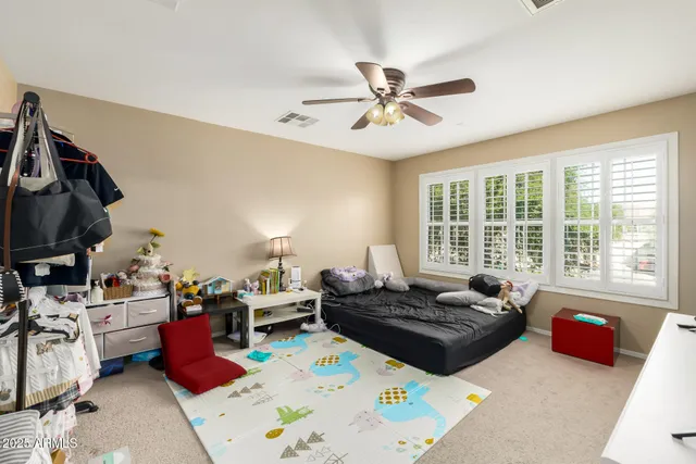 a living room with furniture fireplace and a window