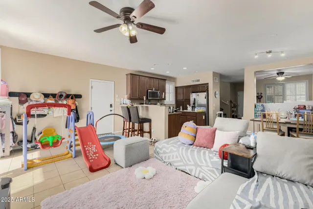 a bedroom with furniture and a flat screen tv