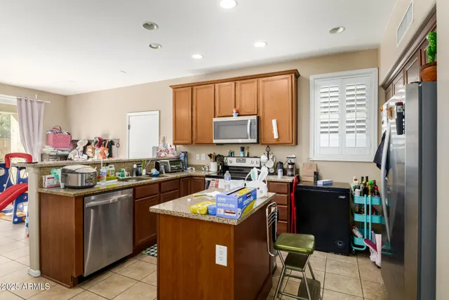 a kitchen with a sink stove and refrigerator