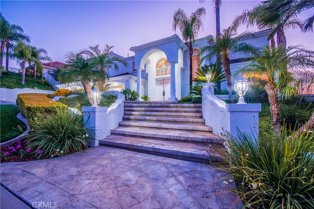 5925 Vía Loma Riverside, CA 92506 - Photo 1 of 1 a front view of a house with a yard and potted plants