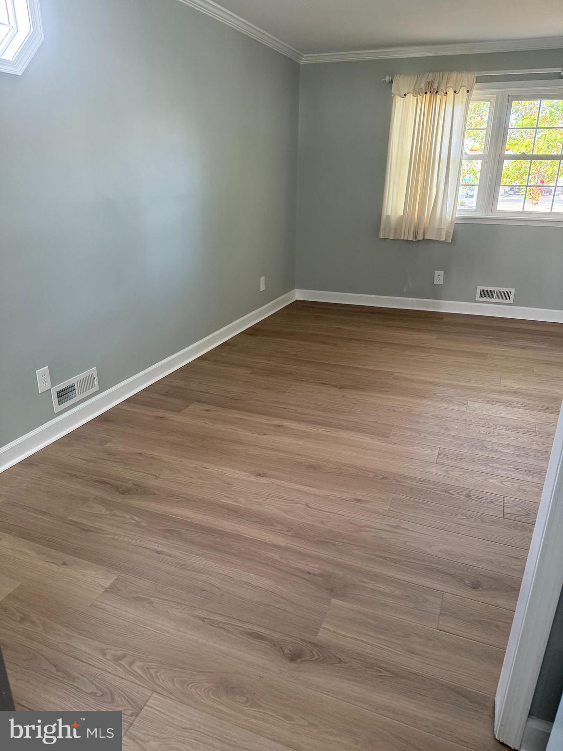 810 South Harmony Road Newark, DE 19713 - Photo 6 of 18 wooden floor in an empty room with a window