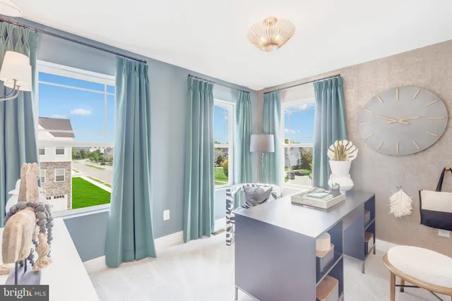 a dining room with furniture and a window