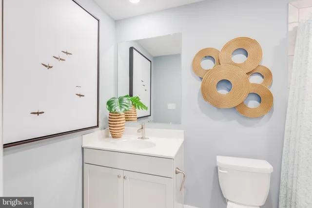 a bathroom with a toilet and a sink