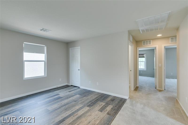 5475 Ordesa Valley Road Las Vegas, NV 89148 - Photo 19 of 35 A quiet and adaptable room with resilient flooring and natural illumination for diverse living.