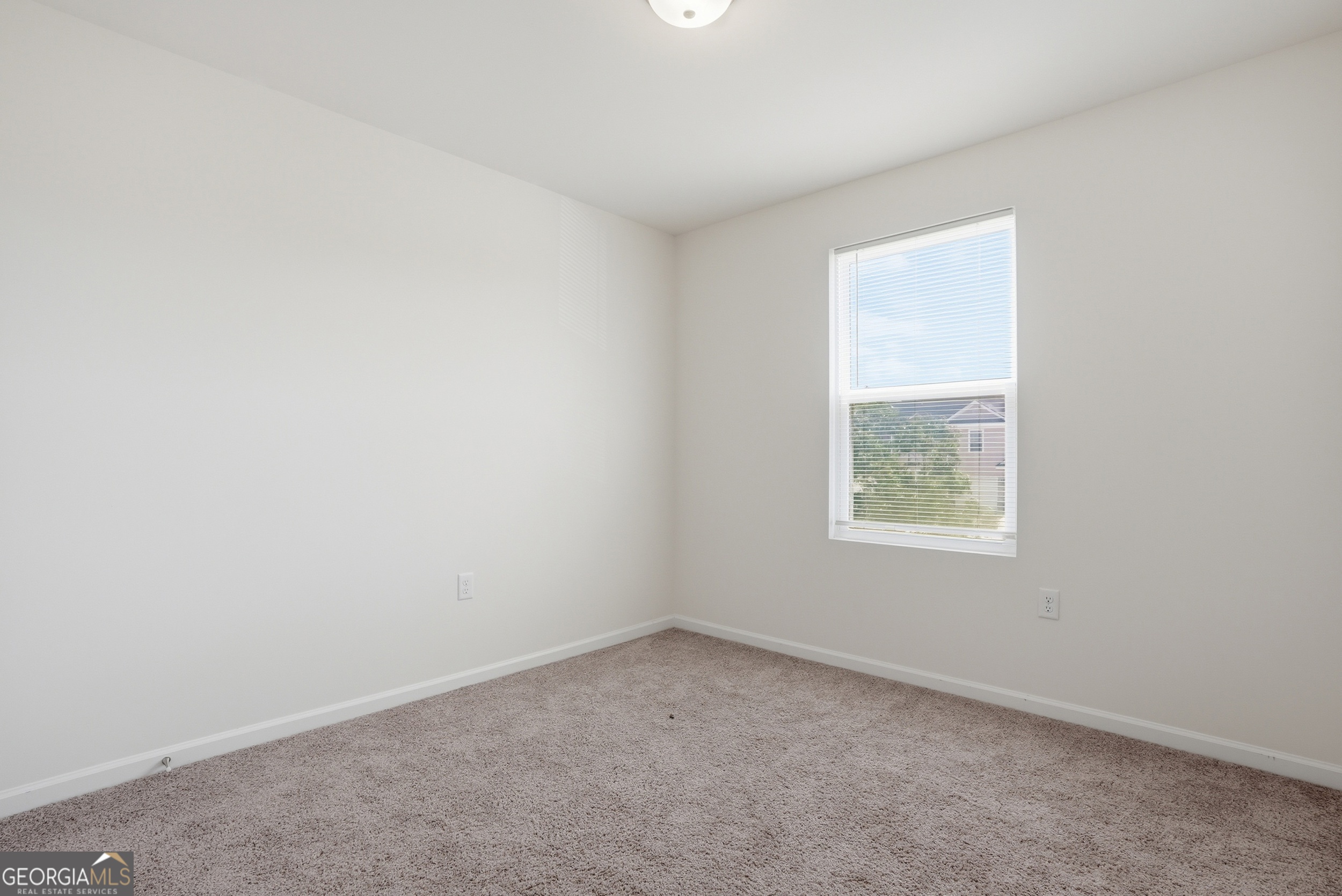 225 Rendell Lane Hinesville, GA 31313 - Photo 29 of 33 an empty room with a window