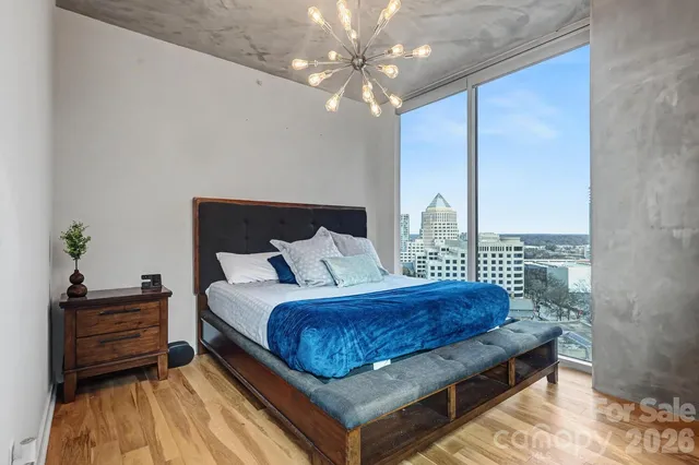 a bedroom with a bed and with furniture