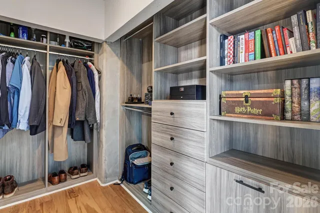 a view of a hallway with a washer and dryer next to a window