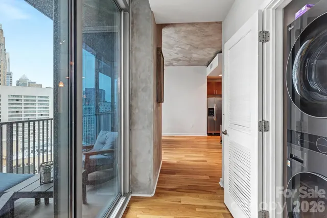 a view of a hallway with washer and dryer