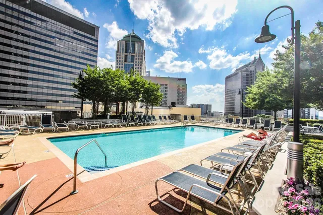 a view of a patio with swimming pool