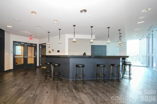 a room with furniture pool table and flat screen tv