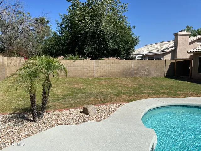 a front view of a house with a yard table and chairs