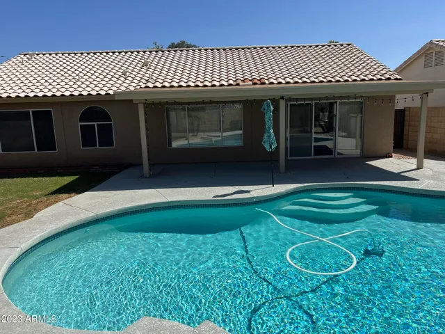 a view of a room with yard from a balcony