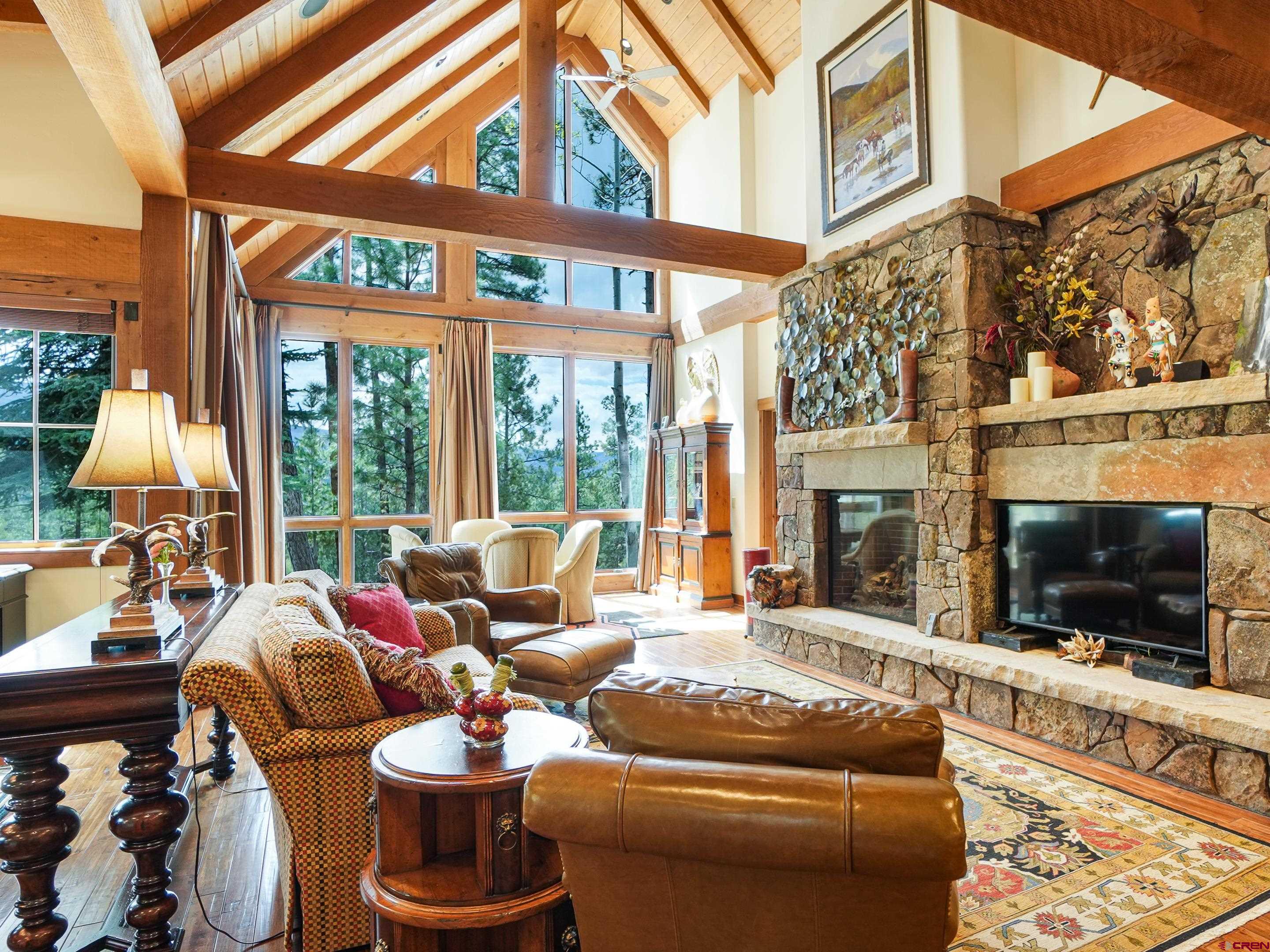 77 Ambush Canyon Durango, CO 81301 - Photo 11 of 25 a living room with fireplace furniture and a flat screen tv
