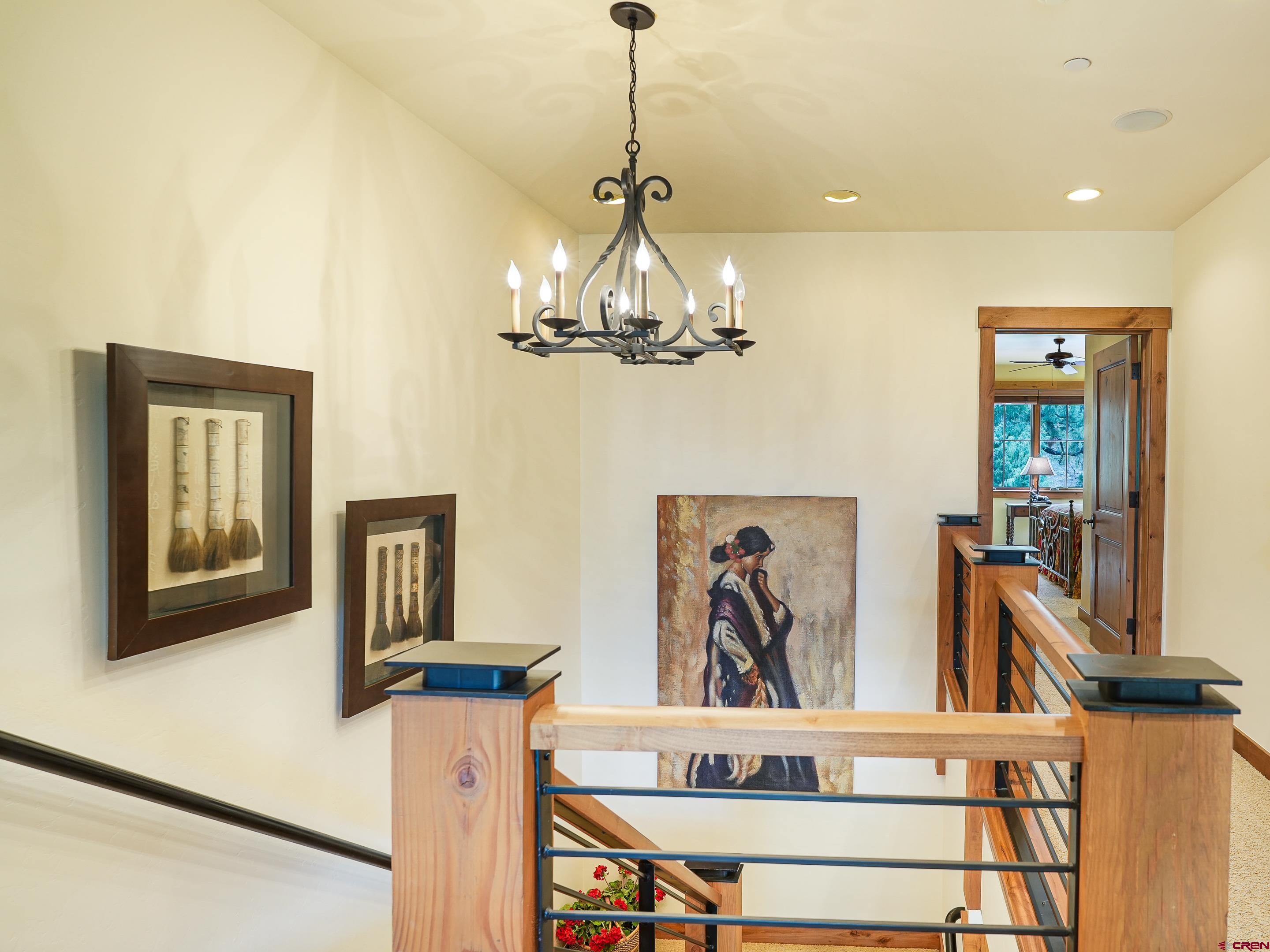 77 Ambush Canyon Durango, CO 81301 - Photo 23 of 25 a view of a hallway with a flower pot and chandelier