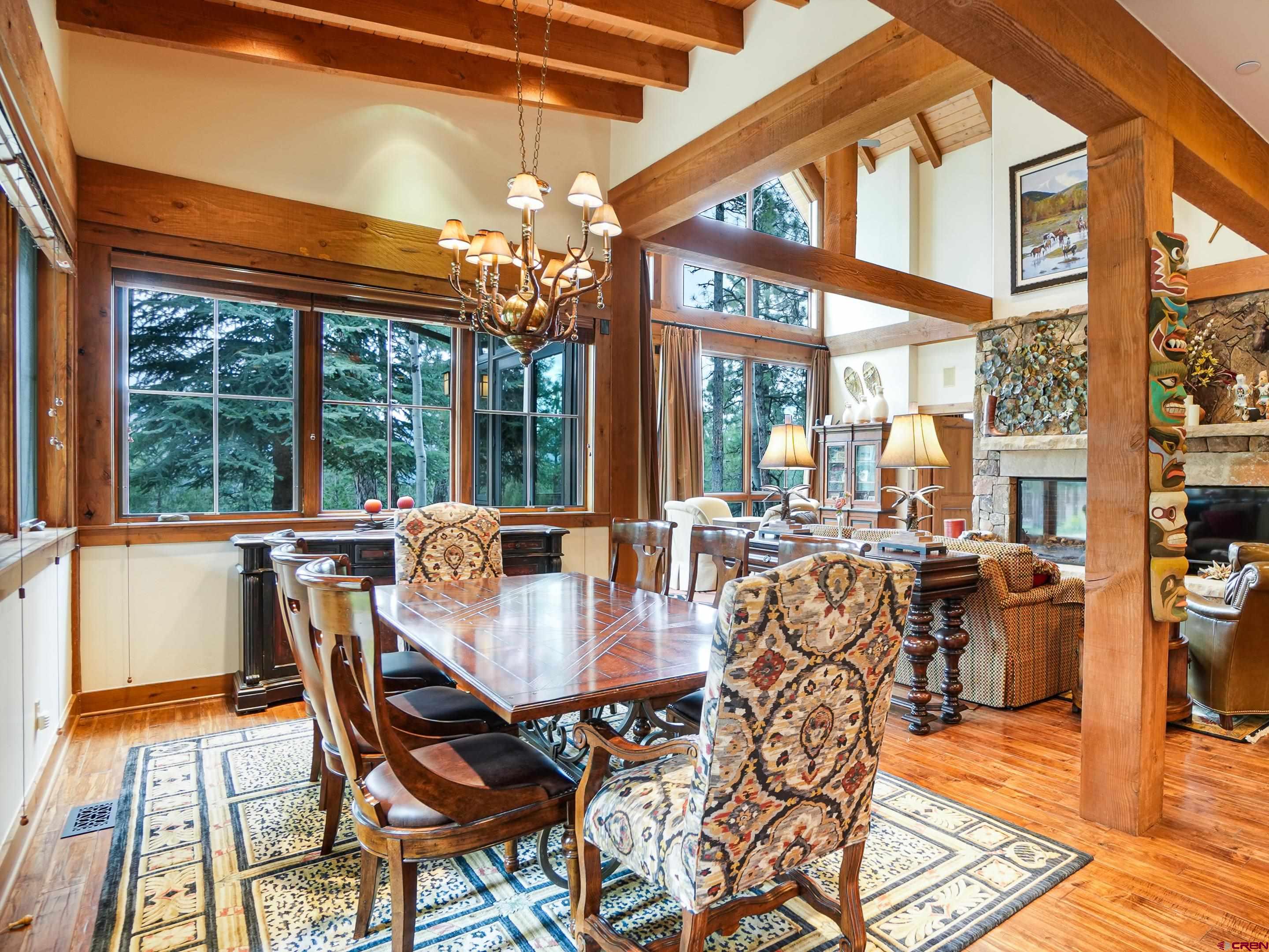 77 Ambush Canyon Durango, CO 81301 - Photo 4 of 25 a view of a dining room with furniture wooden floor and chandelier