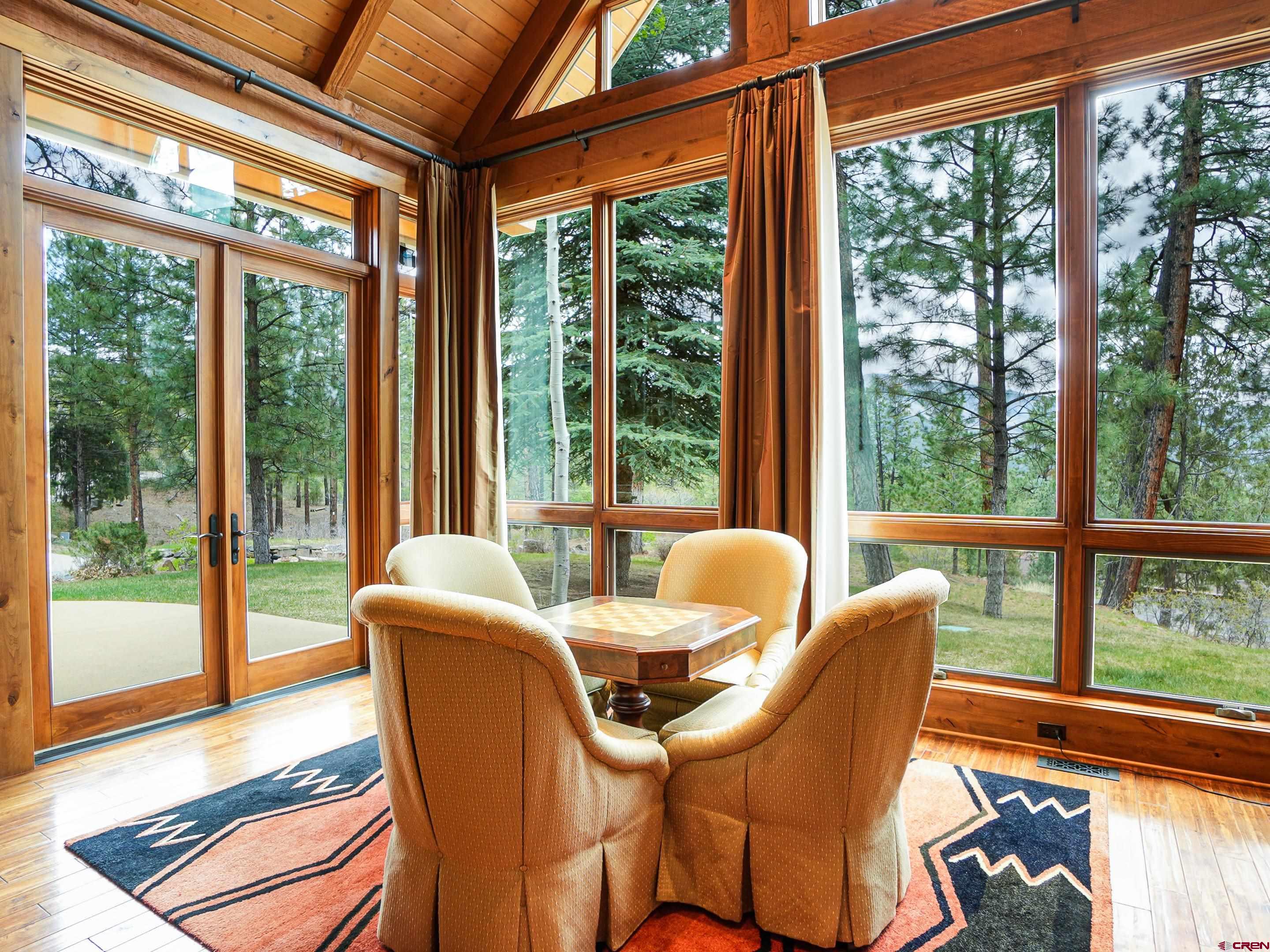 77 Ambush Canyon Durango, CO 81301 - Photo 10 of 25 a view of a city from a dining room with large windows and wooden floor
