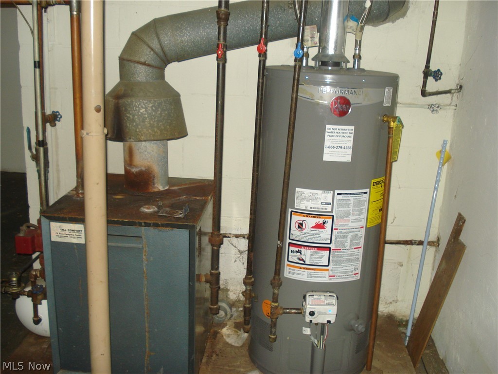 7342 Hopkins Road Mentor, OH 44060 - Photo 41 of 49 Boiler and hot water tank