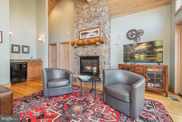 a kitchen with granite countertop a stove a sink and a microwave