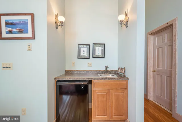 a kitchen with stainless steel appliances granite countertop a stove sink and microwave