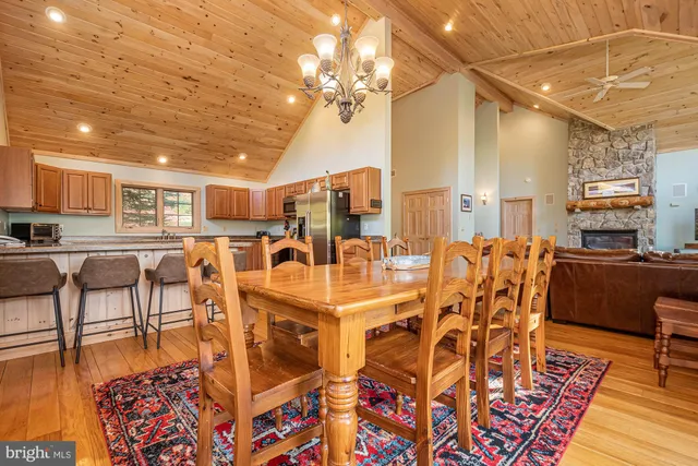 a bed sitting in a spacious bedroom next to a window