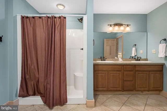 a bedroom with a bed and a night stand