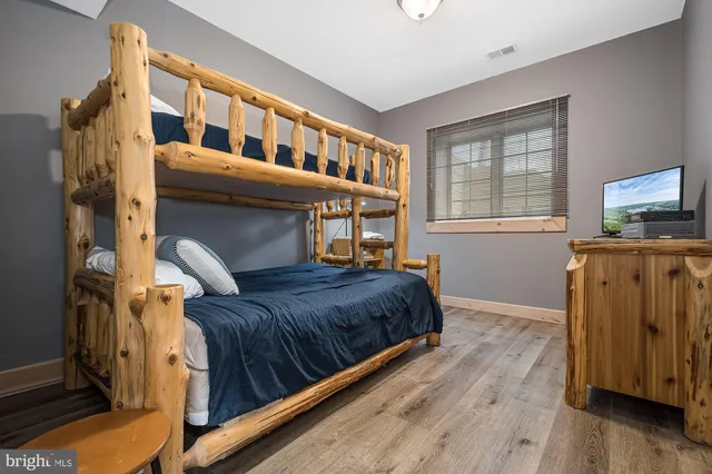 a view of a wooden house with a yard