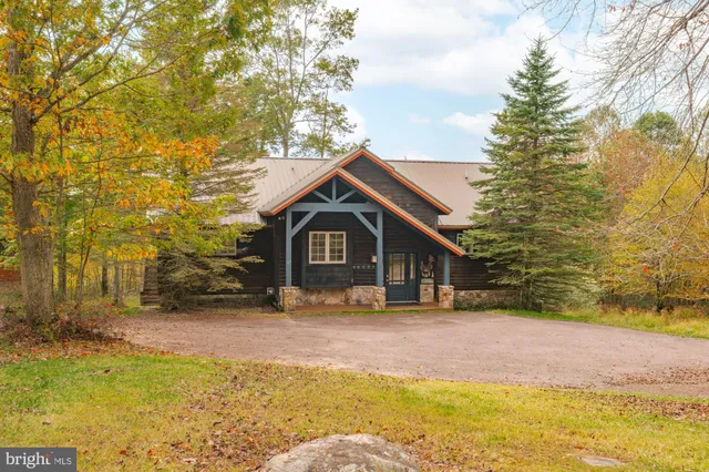 a view of a chairs and table in the balcony