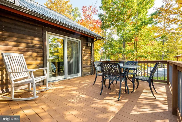 a living room with furniture a rug and a chandelier
