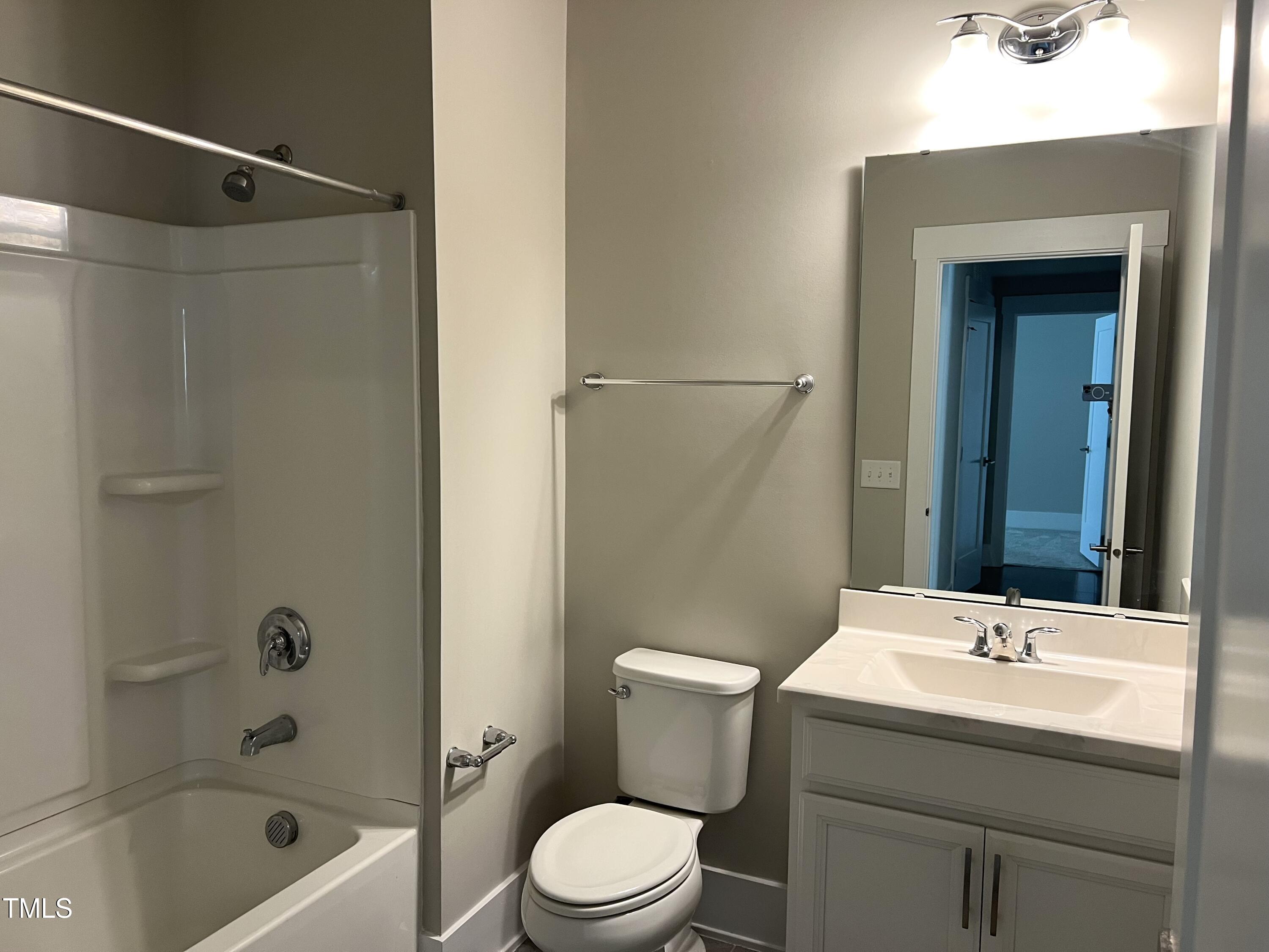 10530 Sablewood Drive, Unit 113 Raleigh, NC 27617 - Photo 20 of 61 a bathroom with a sink toilet and shower