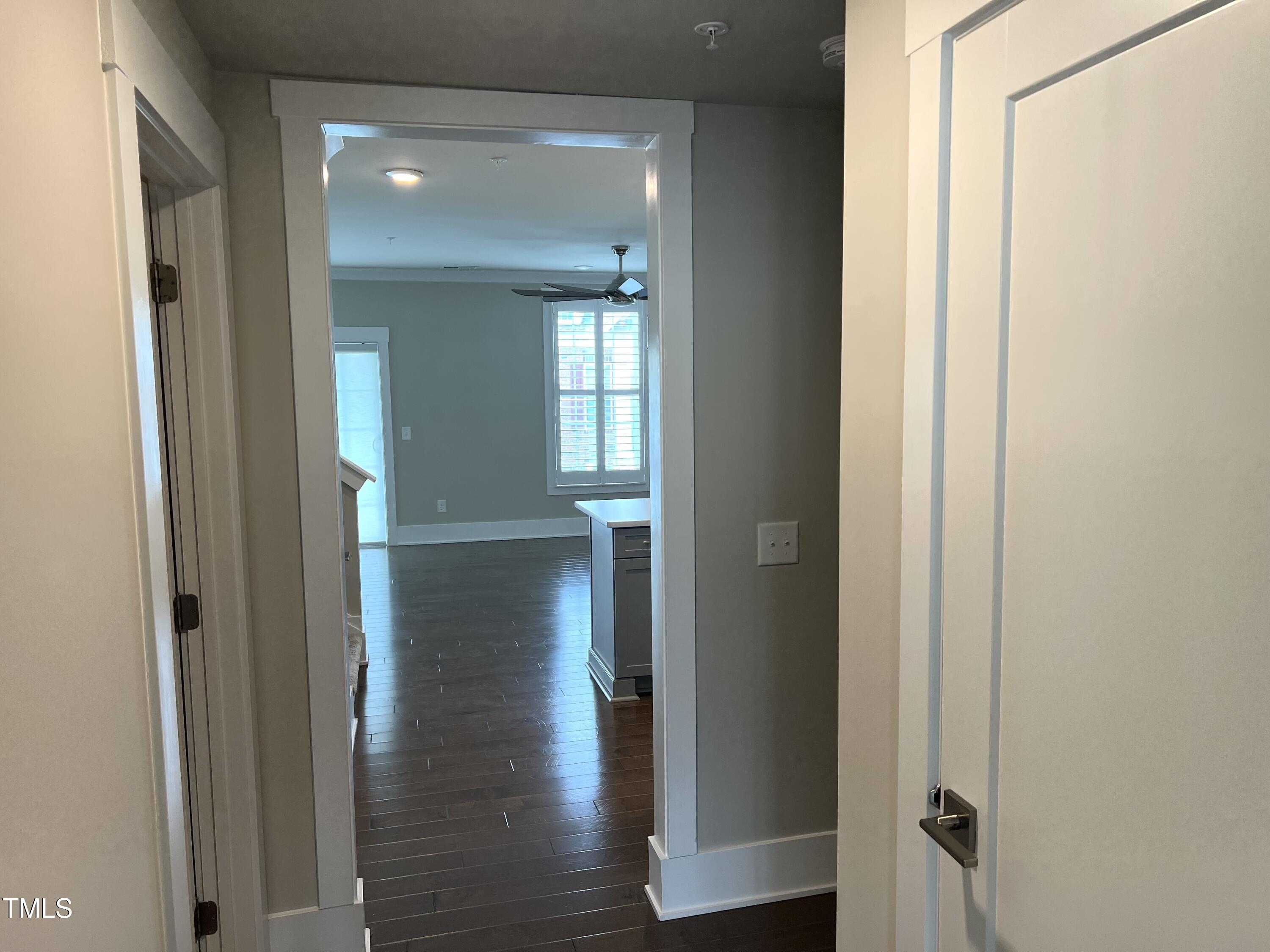 10530 Sablewood Drive, Unit 113 Raleigh, NC 27617 - Photo 22 of 61 an empty room with wooden floor mirror and windows