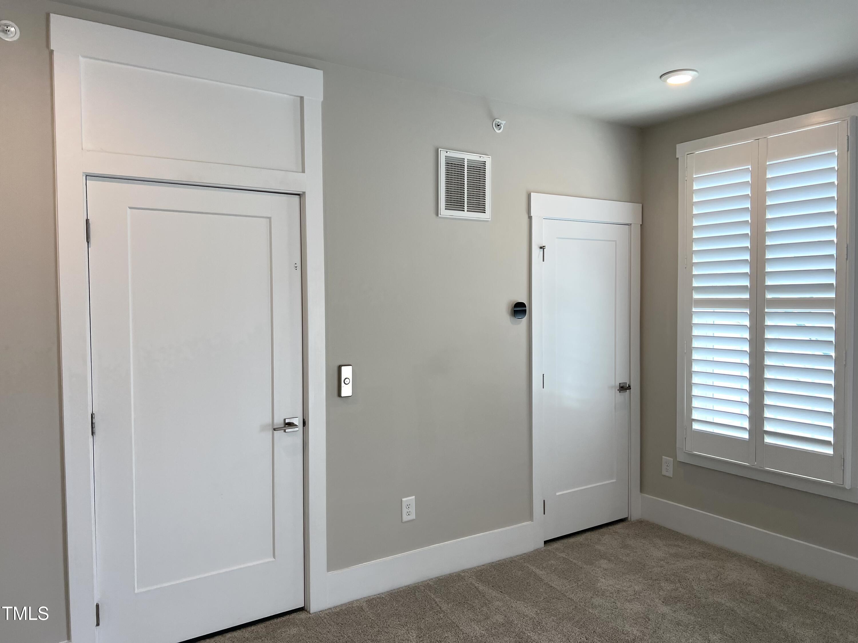 10530 Sablewood Drive, Unit 113 Raleigh, NC 27617 - Photo 41 of 61 an empty room with windows and closet