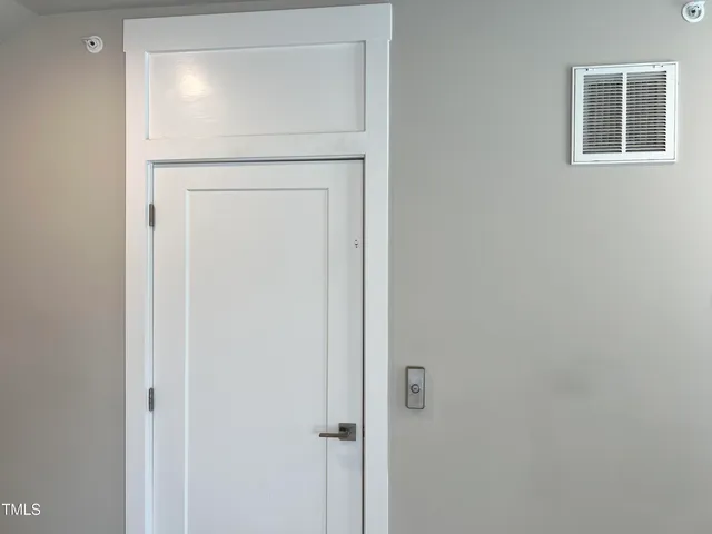 a view of small space with empty refrigerator